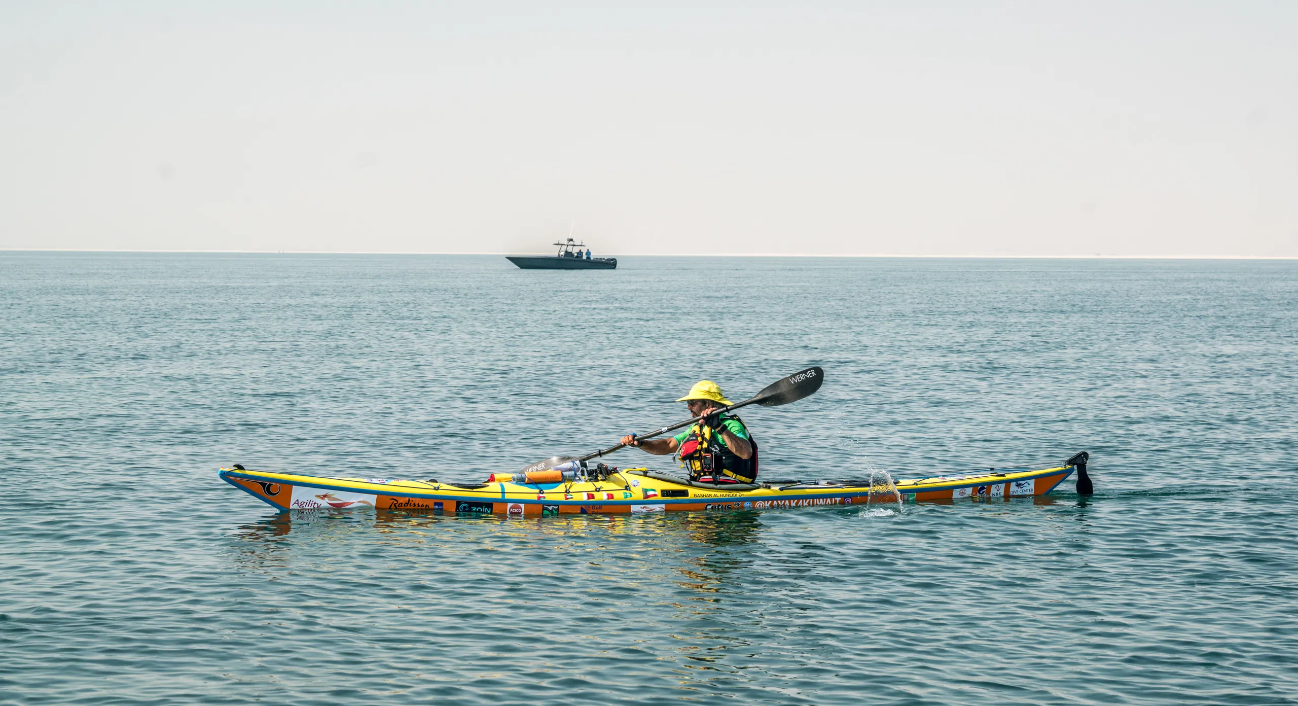 A kayak alone on flat water off the coast